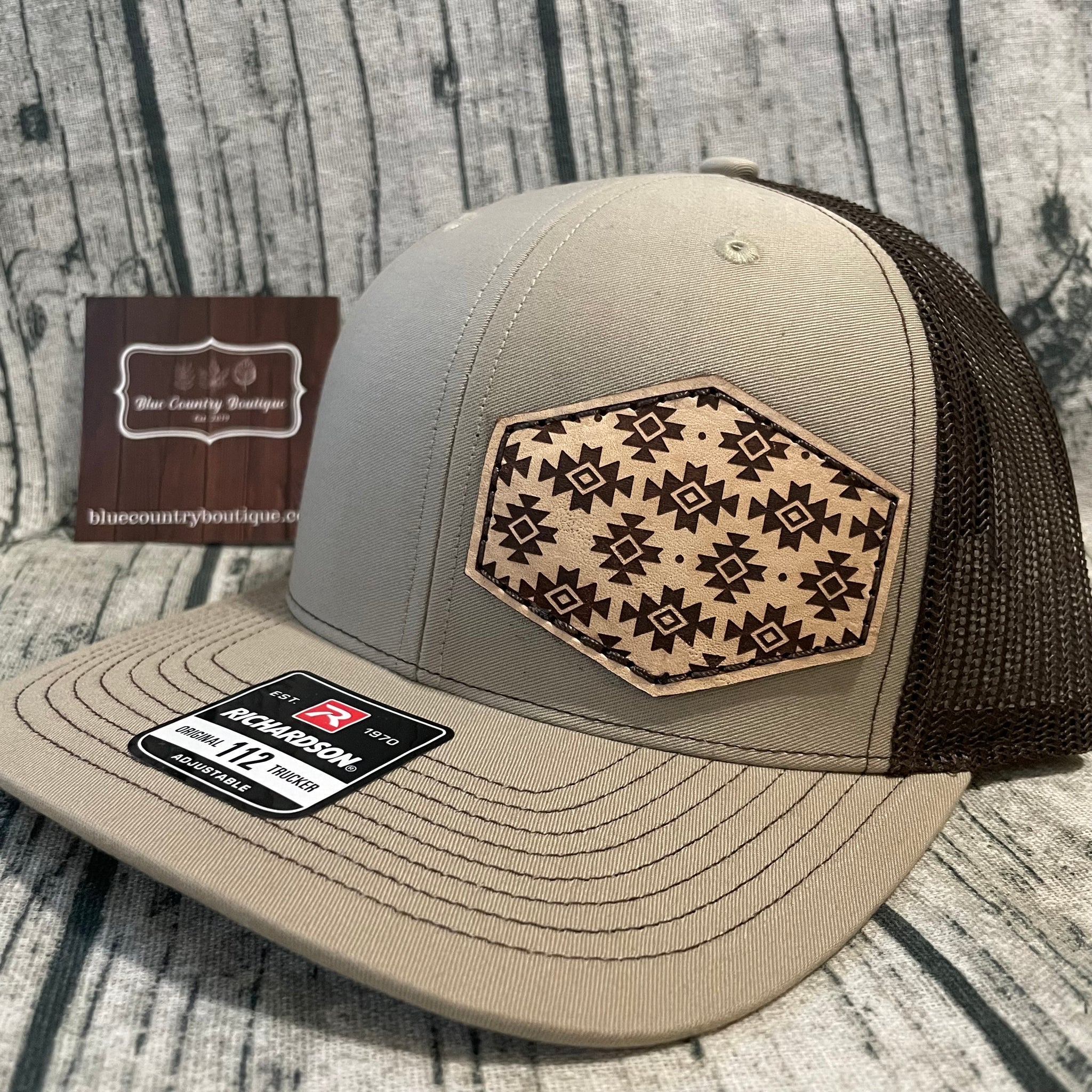 brown/tan trucker cap with Aztec leather patch