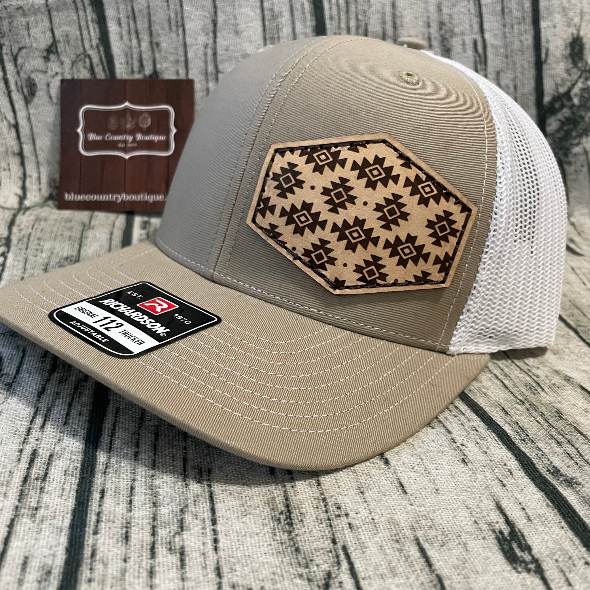 tan/white trucker hat with custom aztec leather patch