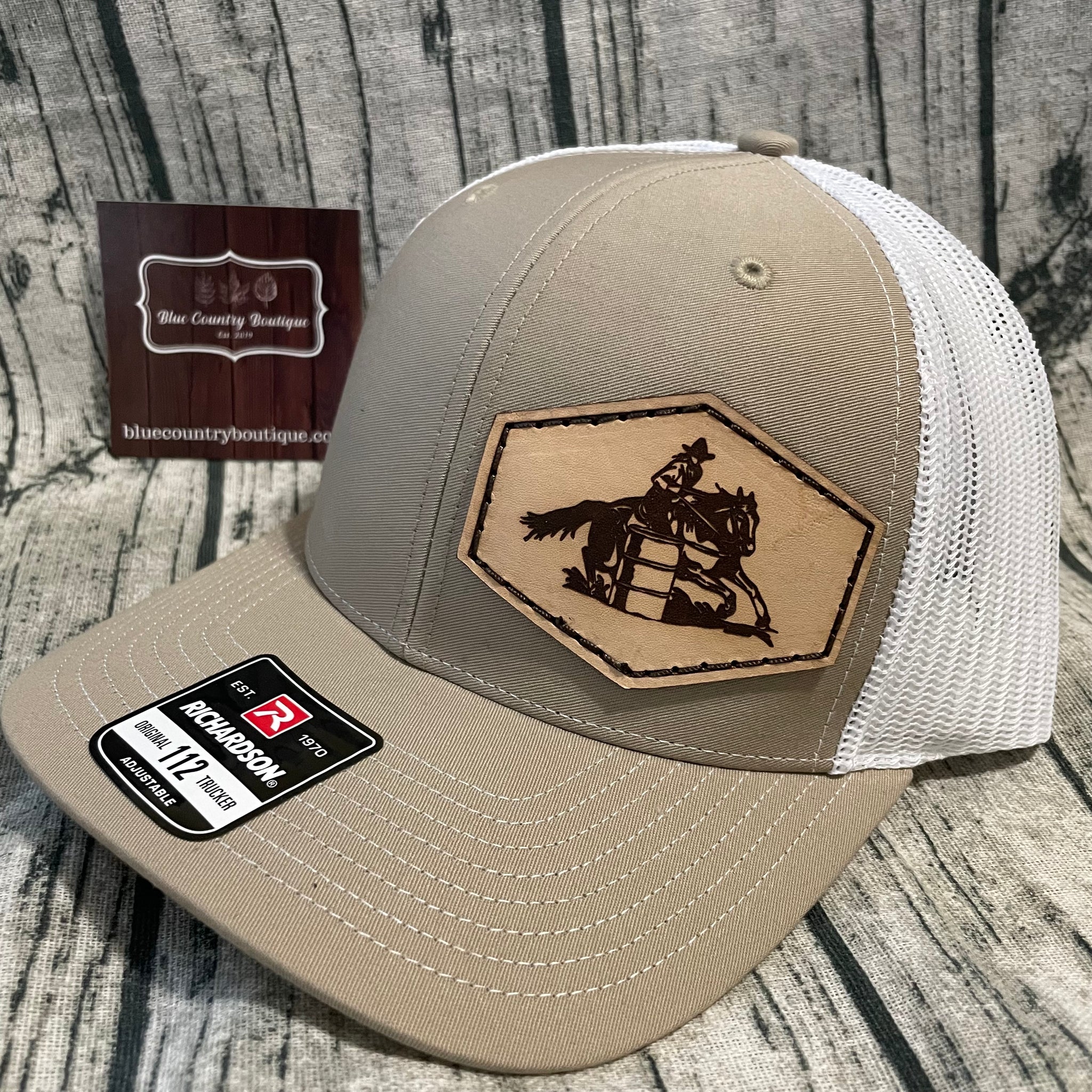 tan/white leather patch barrel racing hat. 